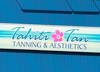 Tahiti Tan sign against a blue background in Saint John, New Brunswick, CA.