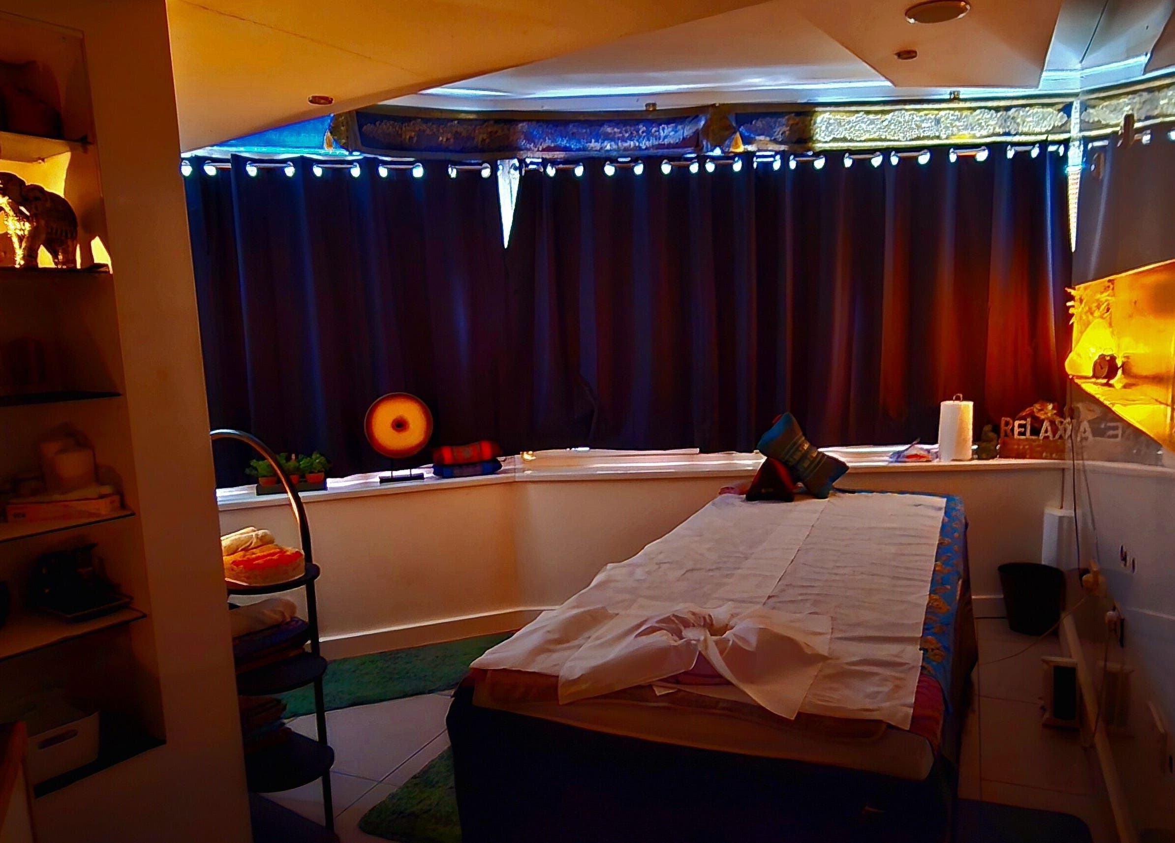 Tranquil therapy room at Panlaan Spa, Weymouth, England, GB, with treatment bed and soft lighting.