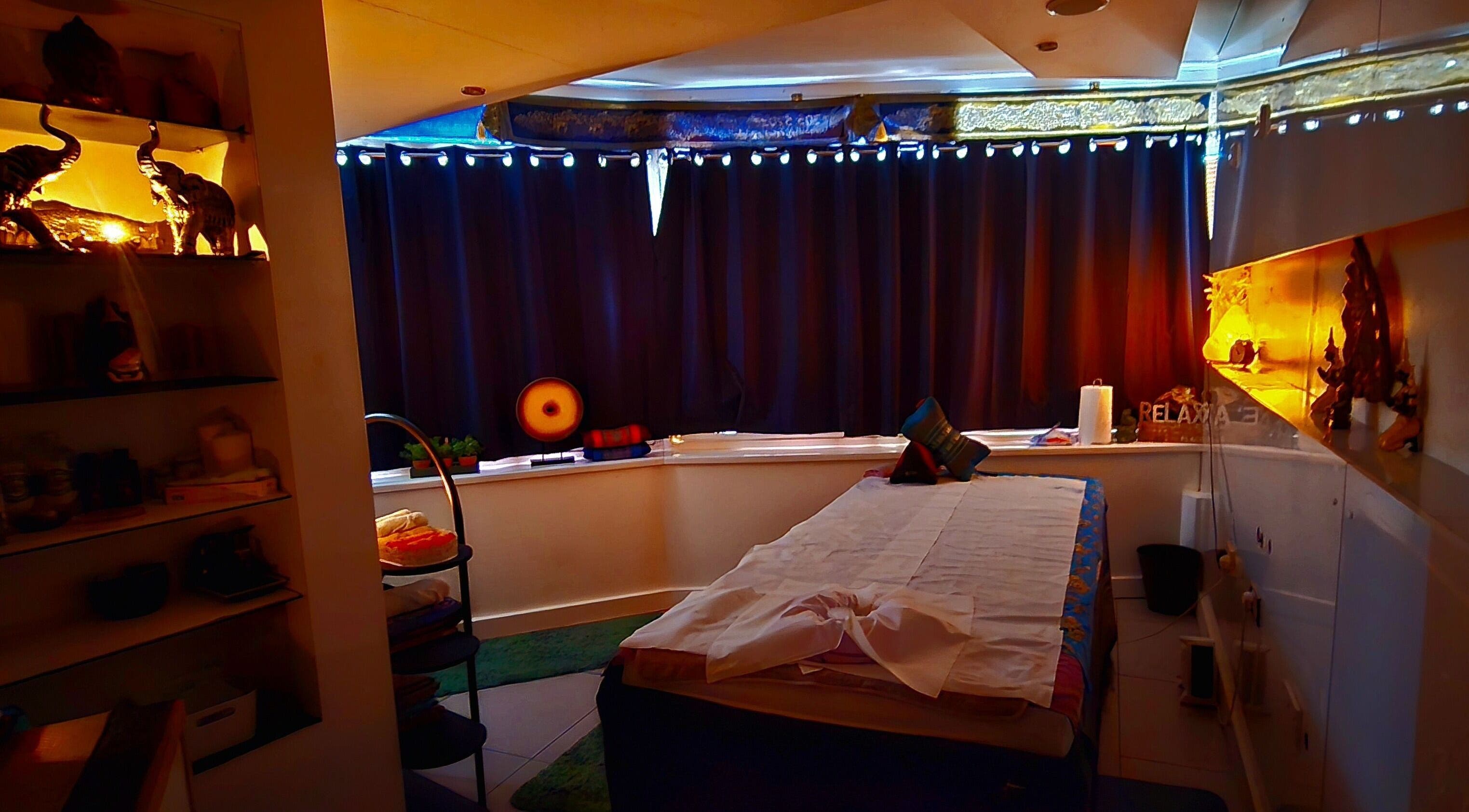 Tranquil therapy room at Panlaan Spa, Weymouth, England, GB, with treatment bed and soft lighting.