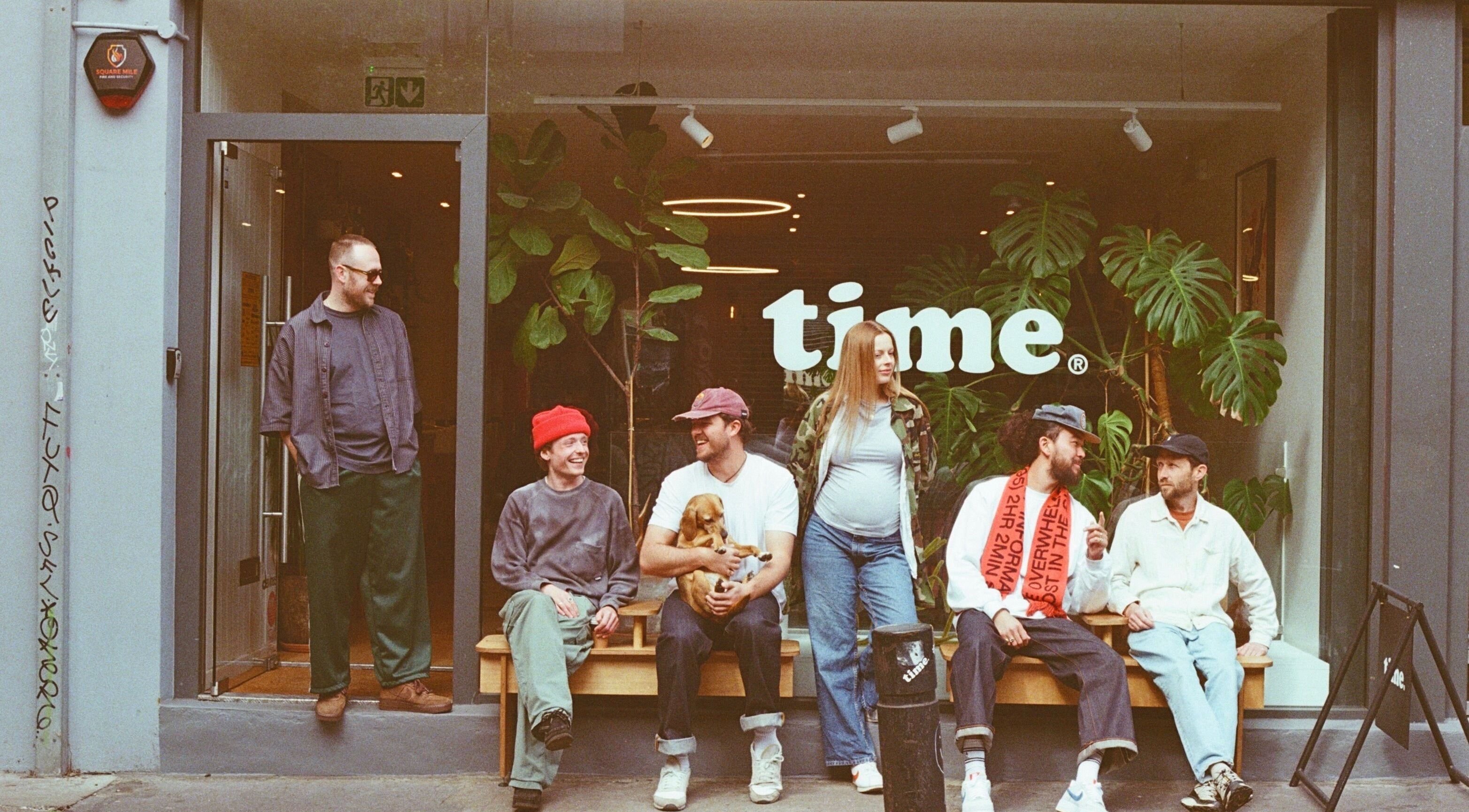 Group enjoying vibrant atmosphere at time. venue, London, England, GB, with cozy outdoor seating.