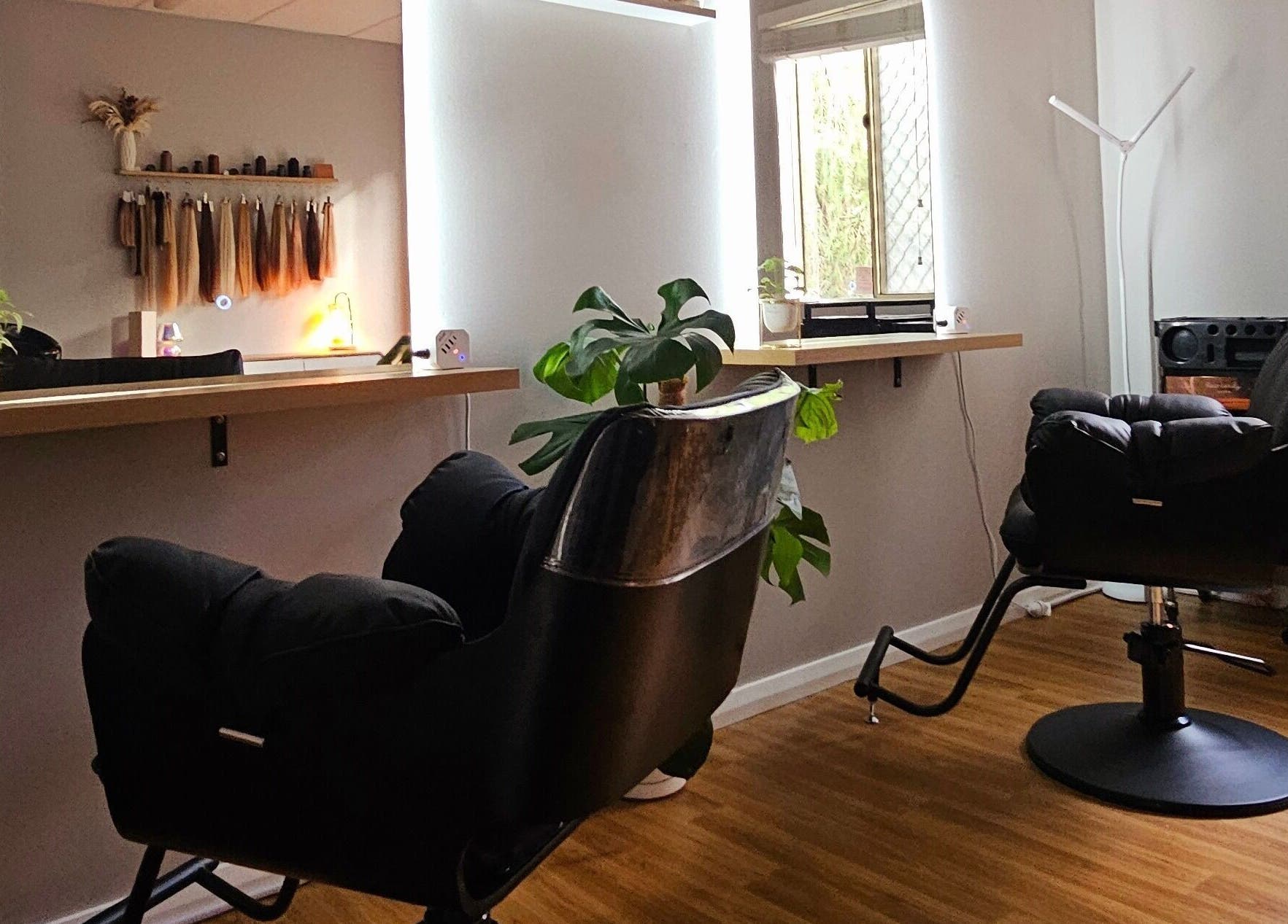 Elegant salon chairs and decor at Hair By Hayley in Milpara, Western Australia, AU, showcasing a modern vibe.