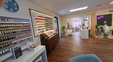 K-Beauty Nail & Spa in Maynard, Massachusetts, features vibrant nail polish displays and a welcoming interior.
