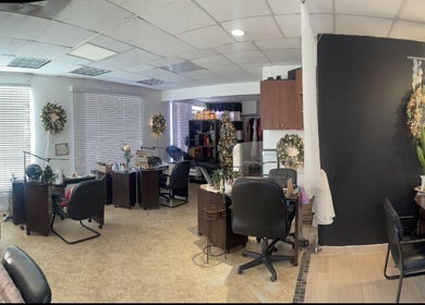 Elegant interior of Nail Gallery & Beauty Bar in Nassau, New Providence, BS with decorated workstations.