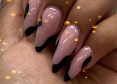 Stunning manicure at Nail Gallery & Beauty Bar, Nassau, New Providence, BS with sleek black-tipped nails.