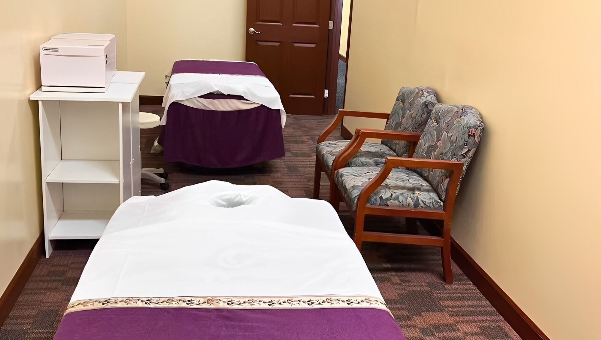 Relaxing massage room at Bristow Massage, Bristow, Virginia, US with cozy chairs and massage beds.