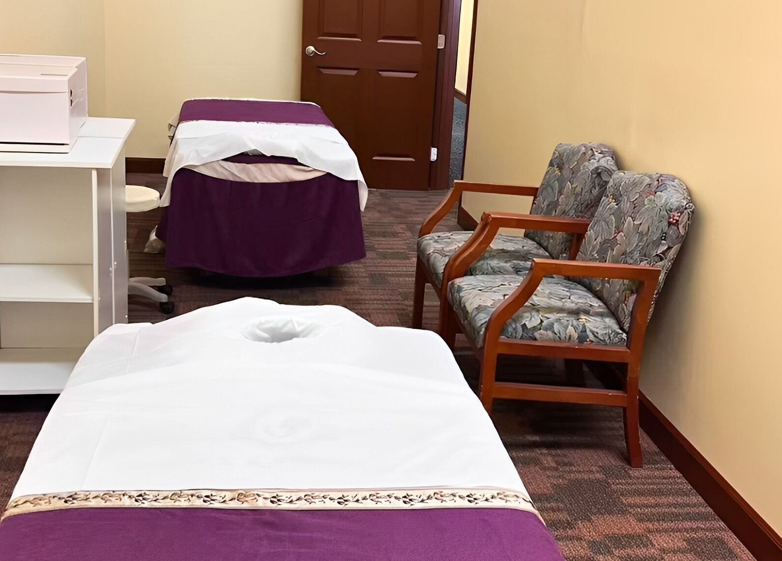 Relaxing massage room at Bristow Massage, Bristow, Virginia, US with cozy chairs and massage beds.