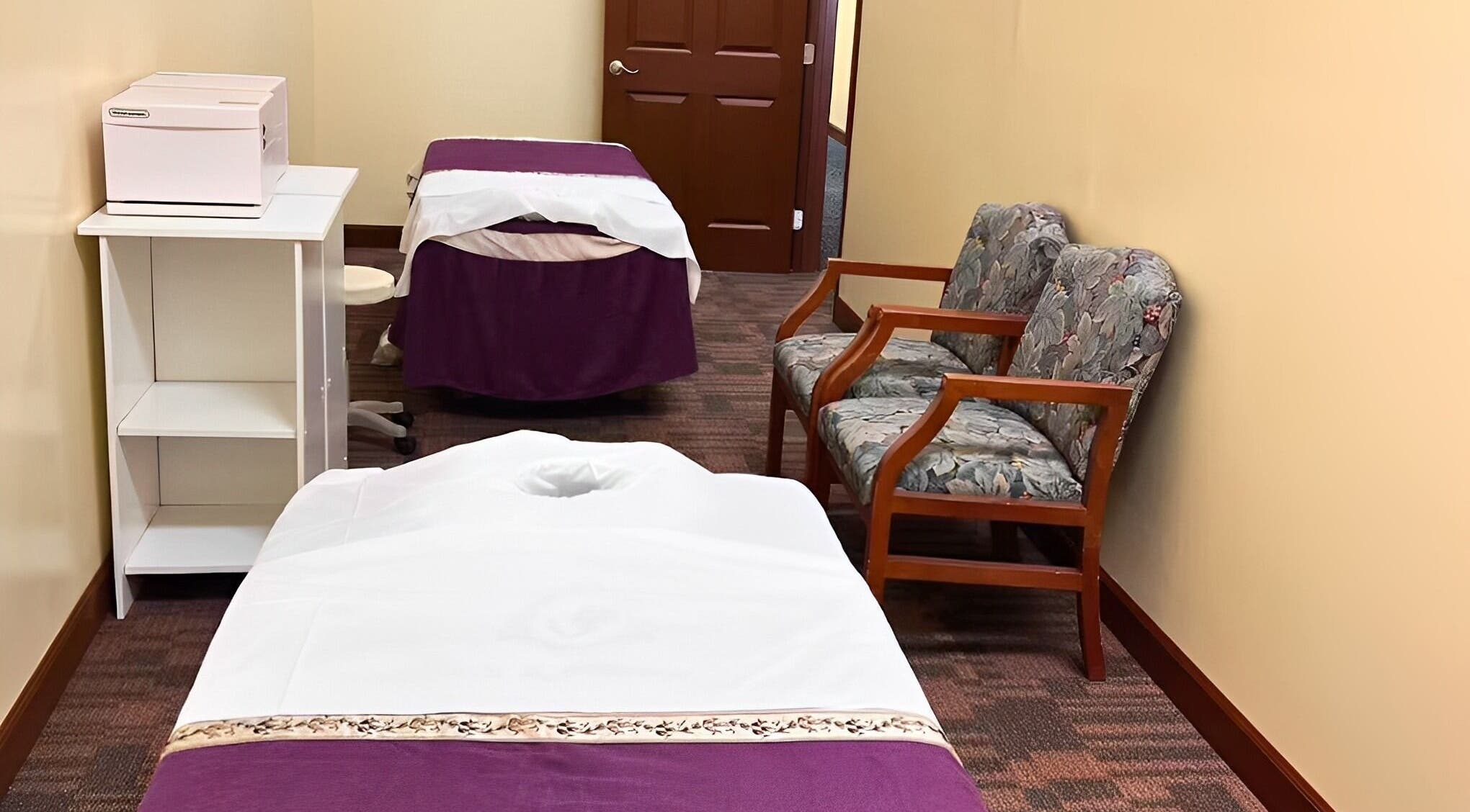 Relaxing massage room at Bristow Massage, Bristow, Virginia, US with cozy chairs and massage beds.