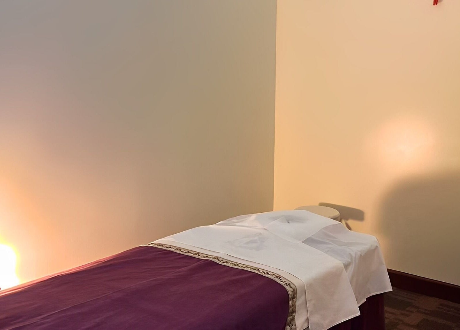 Peaceful massage room at Bristow Massage in Bristow, Virginia, US with warm lighting and a comfortable table.