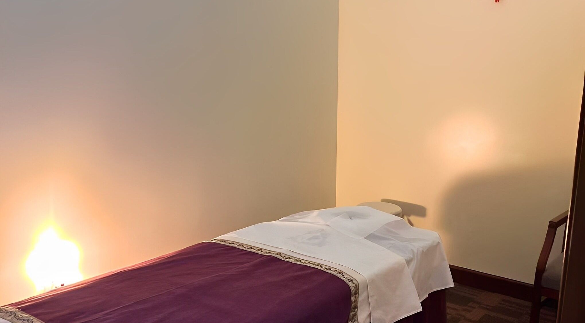 Peaceful massage room at Bristow Massage in Bristow, Virginia, US with warm lighting and a comfortable table.