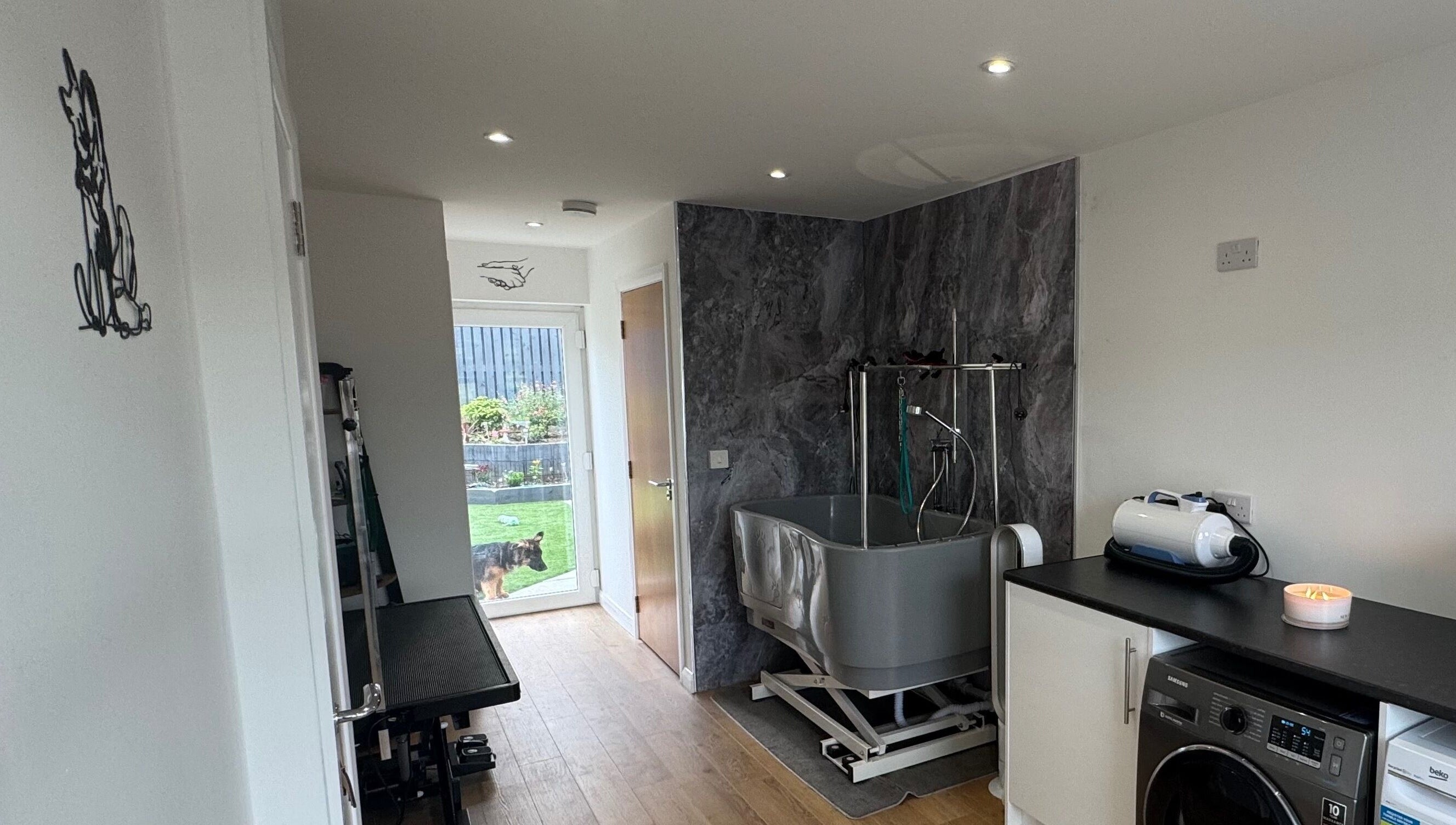 Modern grooming room at Zola’s Dog Grooming - Kirkcaldy, Scotland, GB, featuring a washing station and tools.