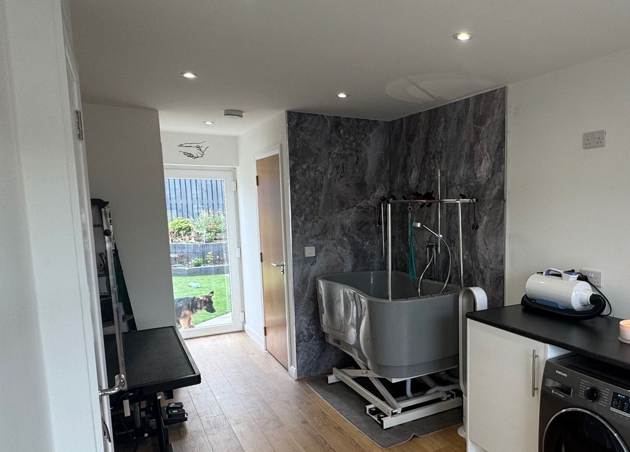 Modern grooming room at Zola’s Dog Grooming - Kirkcaldy, Scotland, GB, featuring a washing station and tools.