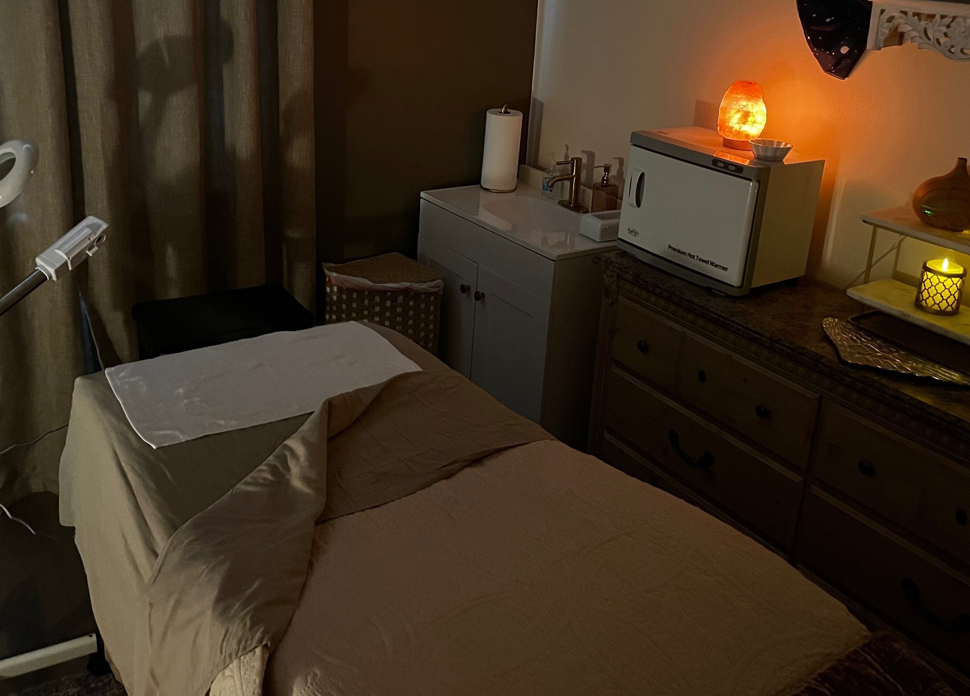 Tranquil spa setup at Immaculate Skin, Santa Fe, New Mexico, US with calming candlelight ambiance.