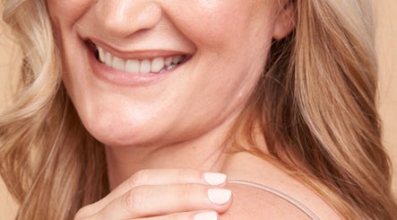 Close-up of woman smiling with manicured nails at Daline Nails, Dee Why, New South Wales, AU.