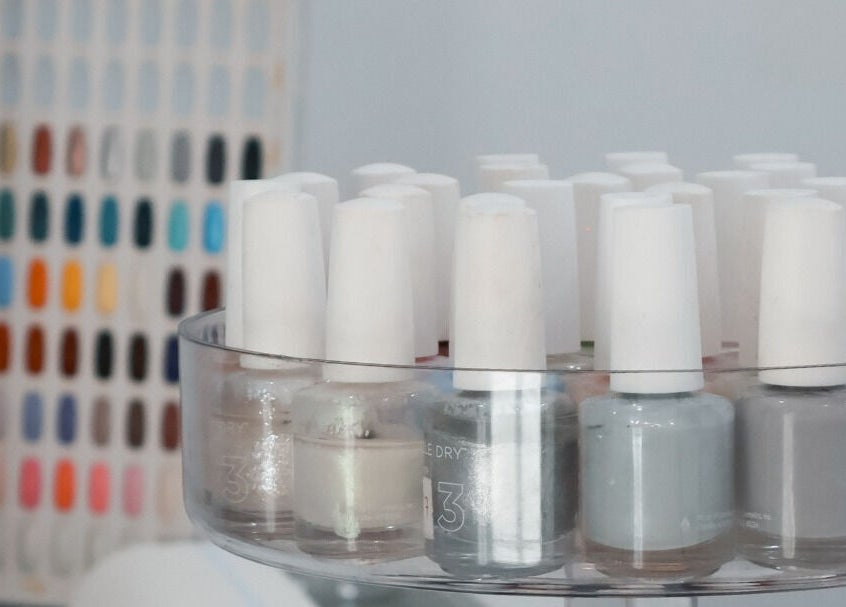 Close-up of nail polish display at Daline Nails, Dee Why, New South Wales, AU showcasing vibrant color options.