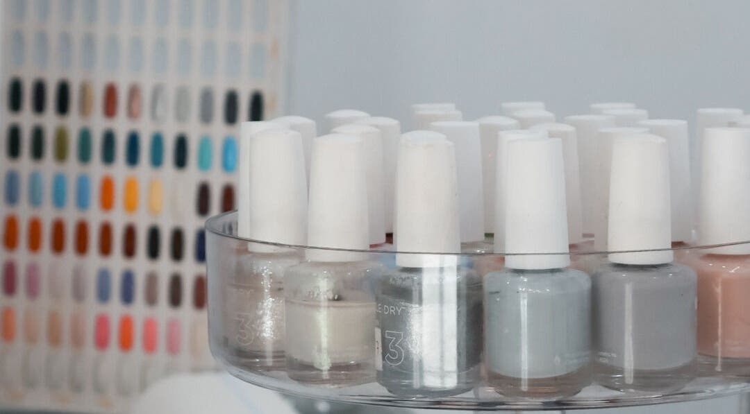 Close-up of nail polish display at Daline Nails, Dee Why, New South Wales, AU showcasing vibrant color options.
