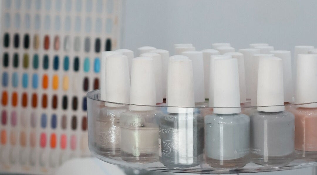 Close-up of nail polish display at Daline Nails, Dee Why, New South Wales, AU showcasing vibrant color options.