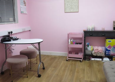 Chic beauty room at Enchanted By Em, Narborough, England, GB. Features pink decor and stylish seating.