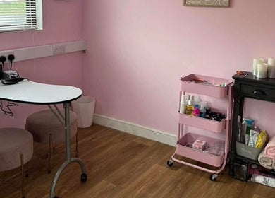 Cozy nail care corner at Enchanted By Em, Narborough, England, GB with pink decor and tools.