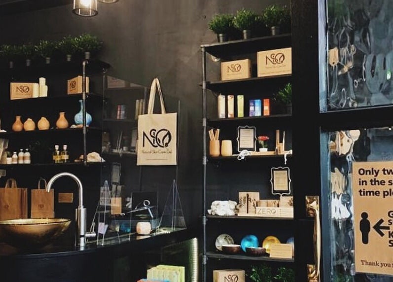 Stylish interior of Spa & Skin Lounge, Hastings, England, GB with shelves of wellness products.