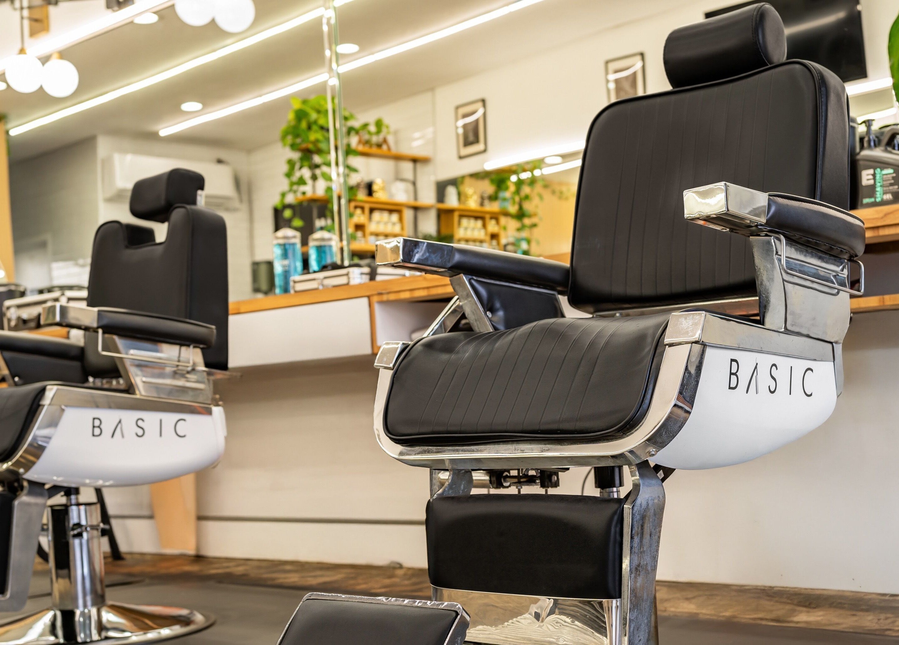 Modern barber chair at Basic Barber in Costa Mesa, California showcasing style and comfort.