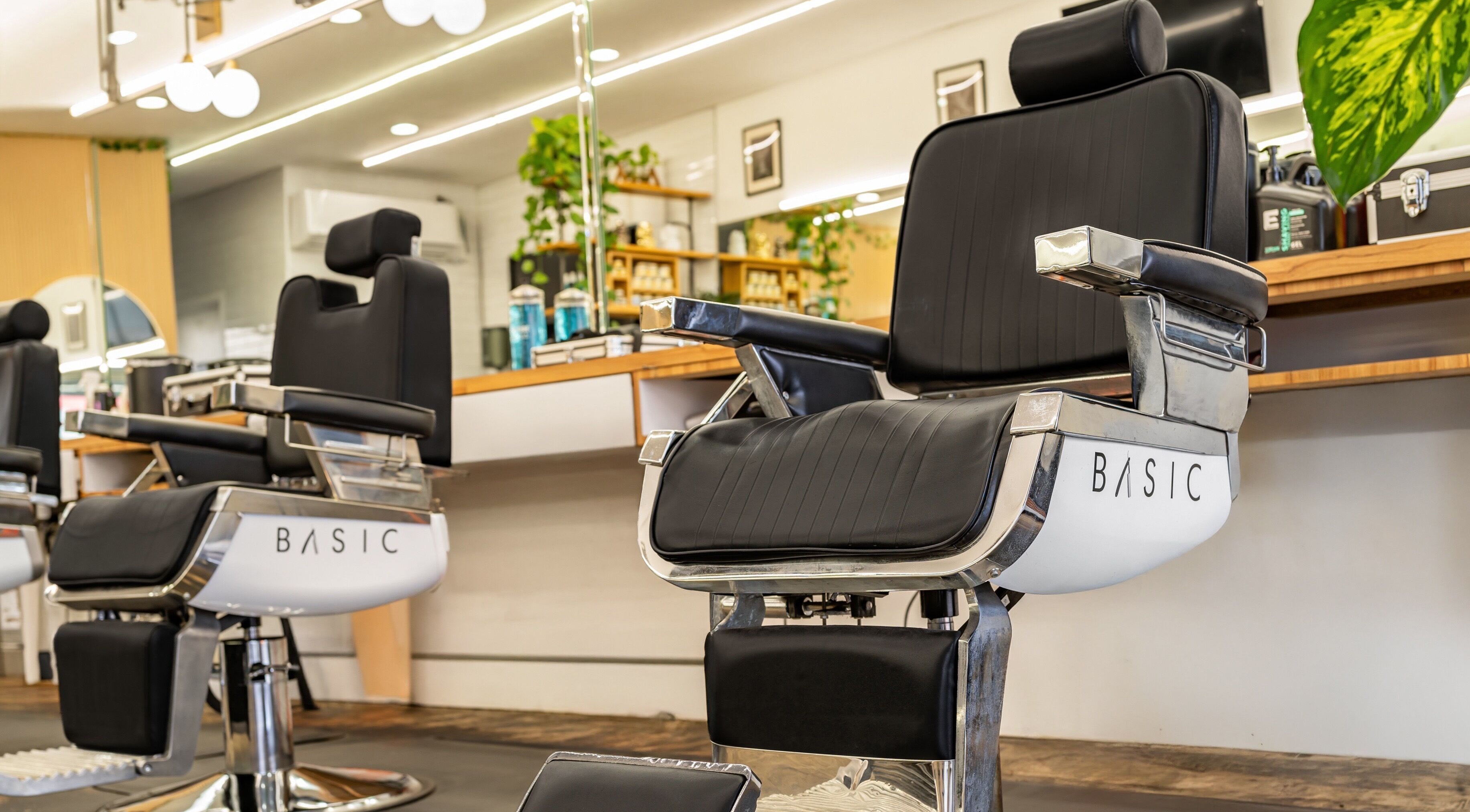Modern barber chair at Basic Barber in Costa Mesa, California showcasing style and comfort.