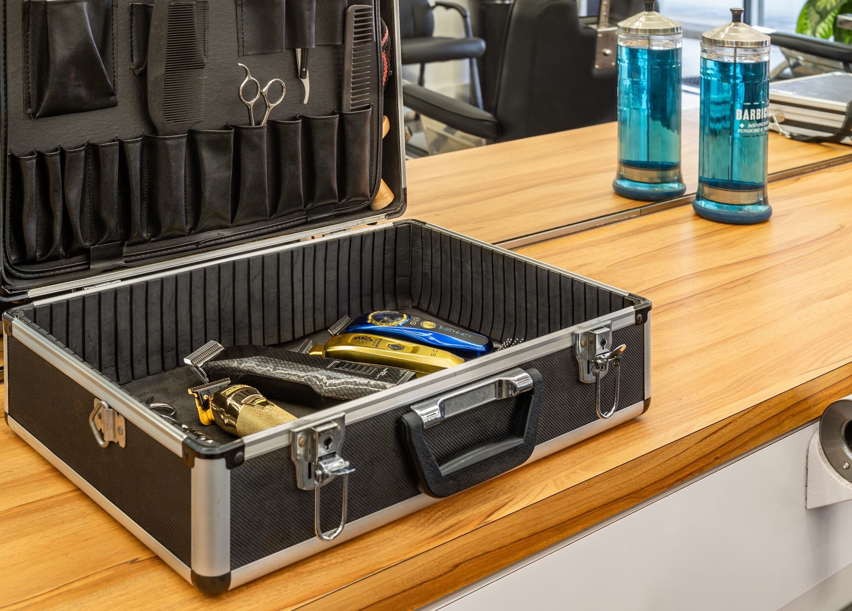 Professional barber tools in an open case at Basic Barber, Costa Mesa, California, US.