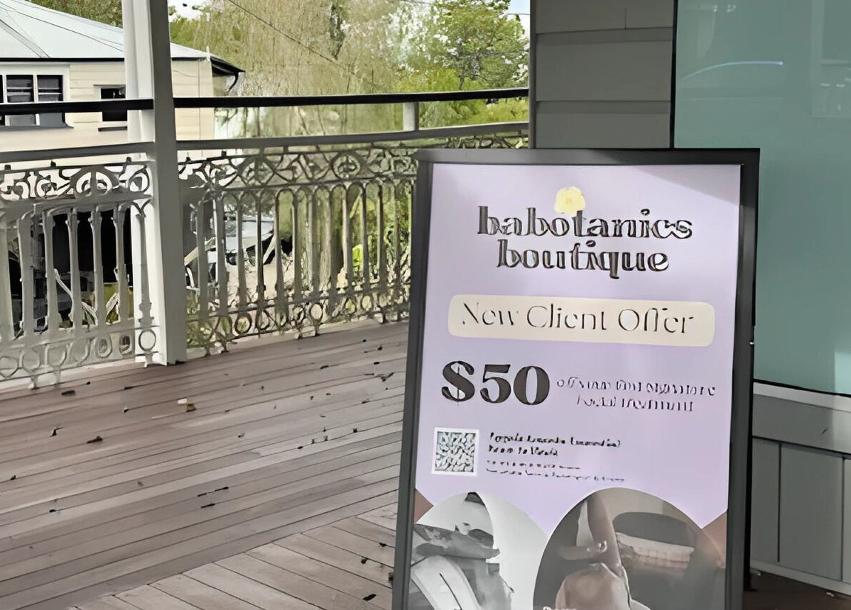 Outdoor sign at Babotanics Boutique in Paddington, Queensland, AU, promoting a $50 new client offer.