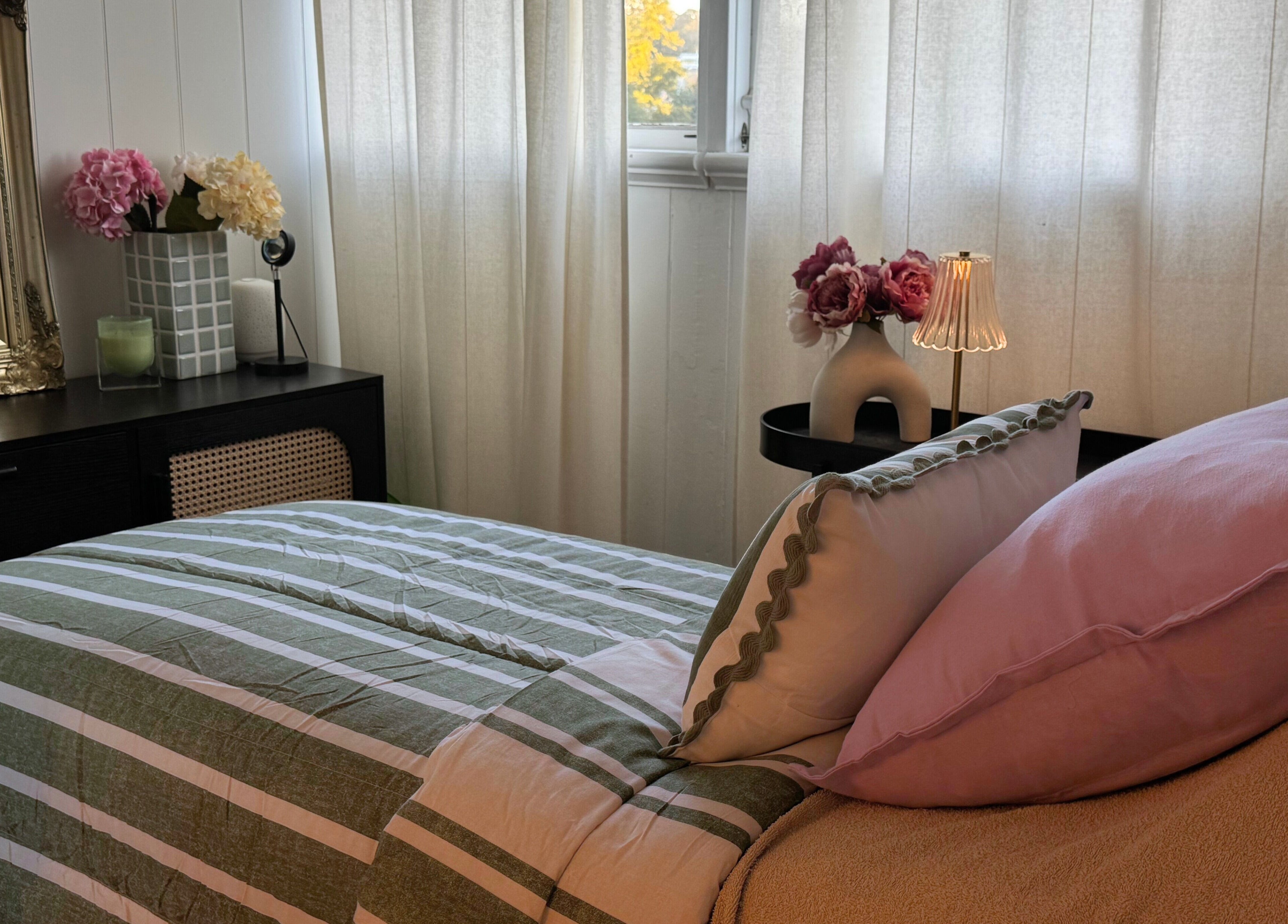 Elegant bedroom at Babotanics Boutique, Paddington, Queensland, AU with floral decor and soft lighting.