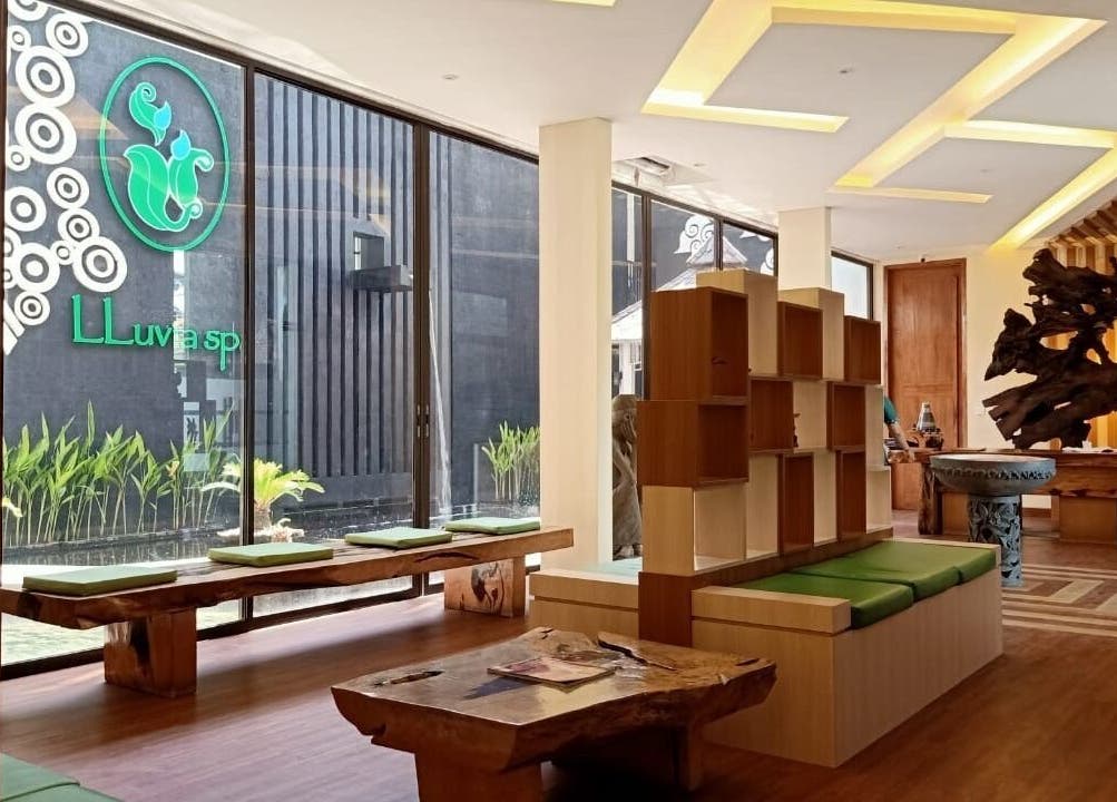 Elegant lobby of LLuvia Spa Bali featuring natural wood decor and green accents in Bali, Bali, ID.