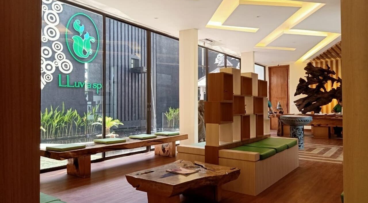 Elegant lobby of LLuvia Spa Bali featuring natural wood decor and green accents in Bali, Bali, ID.