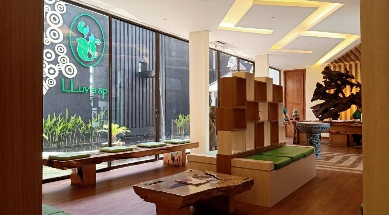 Elegant lobby of LLuvia Spa Bali featuring natural wood decor and green accents in Bali, Bali, ID.
