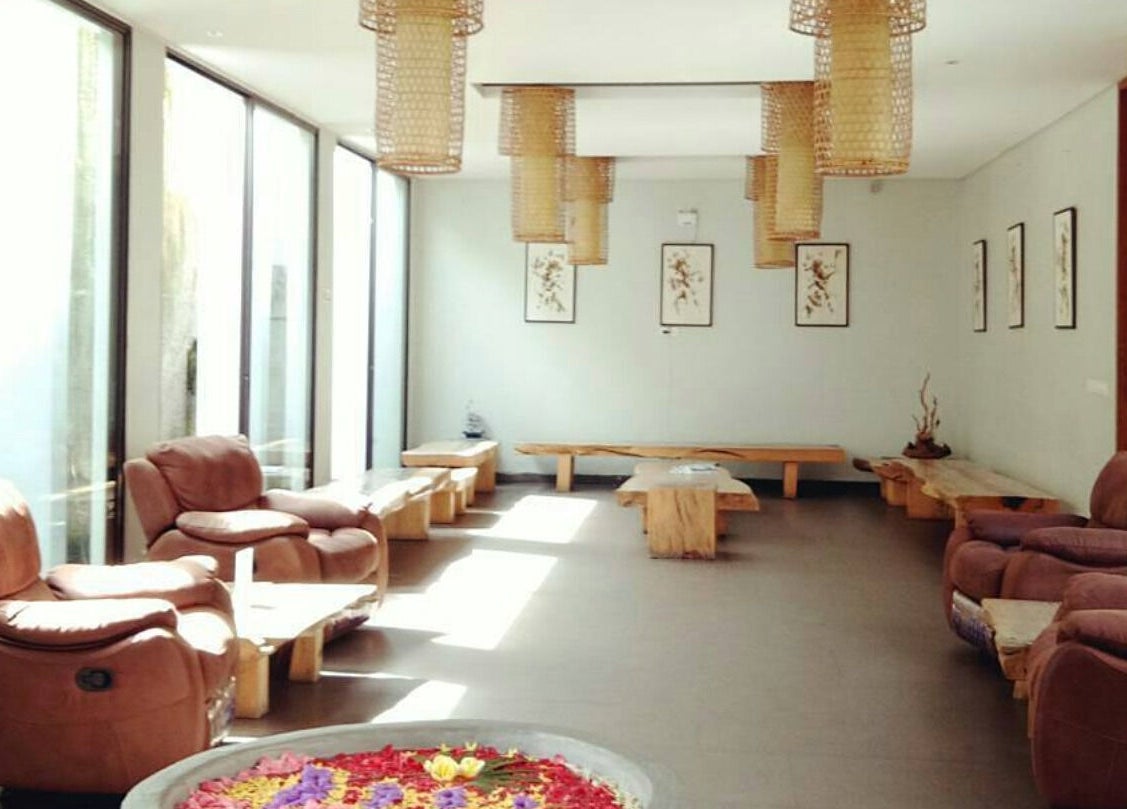 Elegant seating area at LLuvia Spa Bali featuring cozy chairs and natural decor in Bali, Bali, ID.