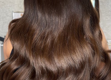 Shiny wavy brunette hair styled at Molly Grace Hair, Market Bosworth, England, GB.