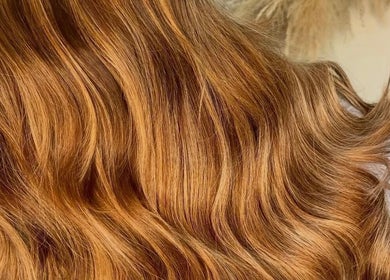 Close-up of golden brown hair styled in waves at Molly Grace Hair, Market Bosworth, England, GB.