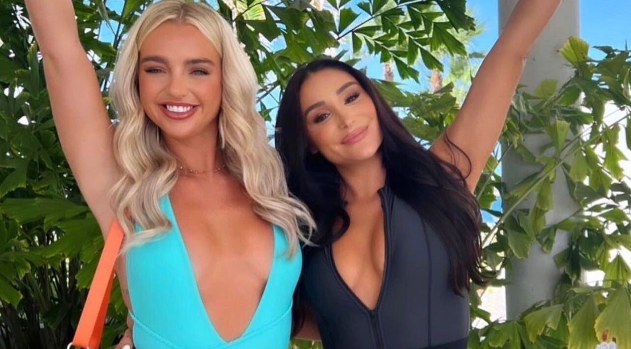 Two women smiling outdoors, showcasing styles by Ibiza Hair & Makeup Mobile, Ibiza, GB.