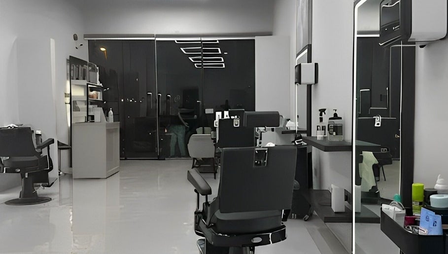 Chic interior of The Protocol Barbershop in Riyadh, Riyadh Province, SA, featuring modern barber chairs and sleek decor.