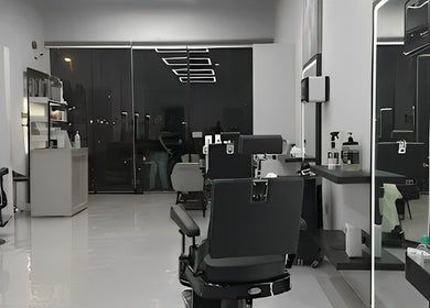 Chic interior of The Protocol Barbershop in Riyadh, Riyadh Province, SA, featuring modern barber chairs and sleek decor.