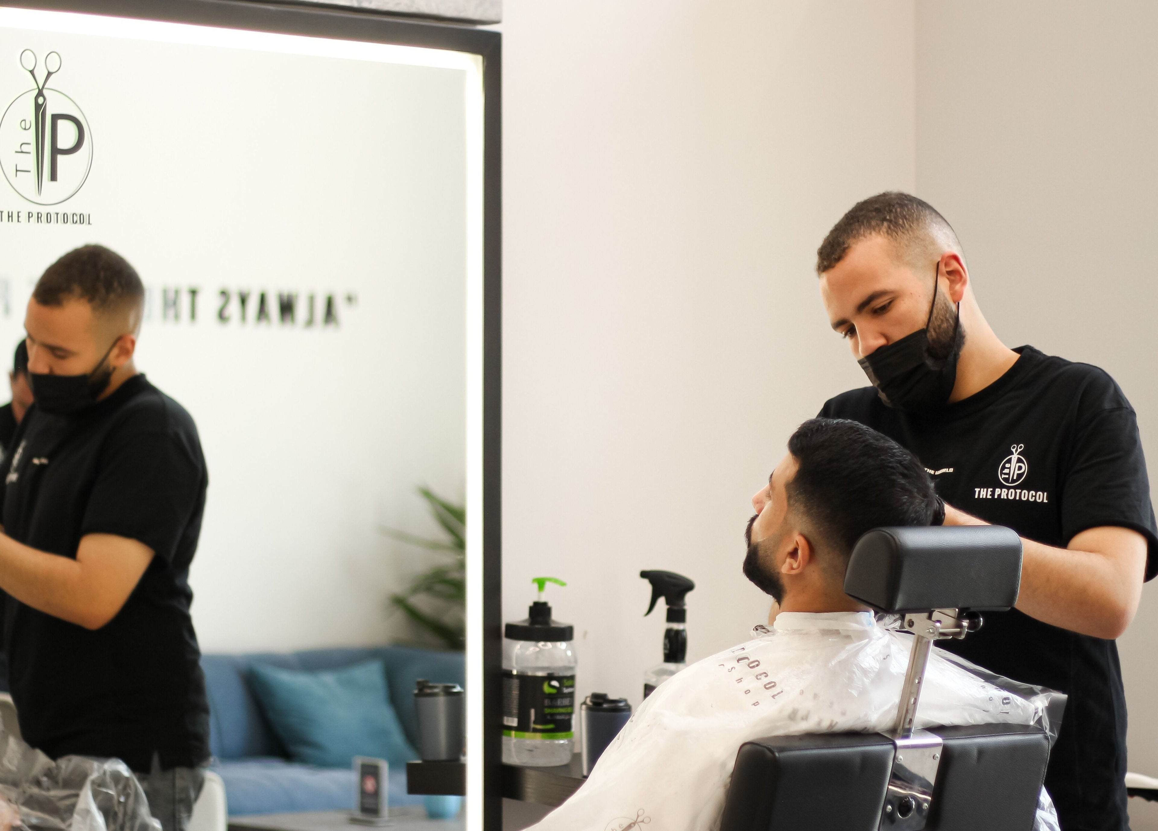 The Protocol Barbershop stylist attending customer in Riyadh, Riyadh Province, SA.