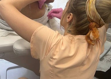 Beauty specialist performing a body treatment at Modern Goddess Zone, Brighton And Hove, England, GB.