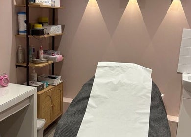 Cozy treatment room at Modern Goddess Zone in Brighton And Hove, England, GB. Shelves with wellness products.