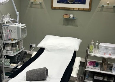 Modern Goddess Zone spa room in Brighton And Hove, England, GB, featuring a comfortable treatment table and equipment.