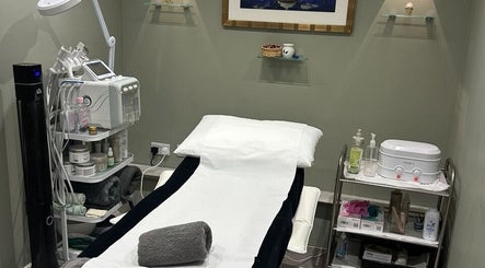 Modern Goddess Zone spa room in Brighton And Hove, England, GB, featuring a comfortable treatment table and equipment.