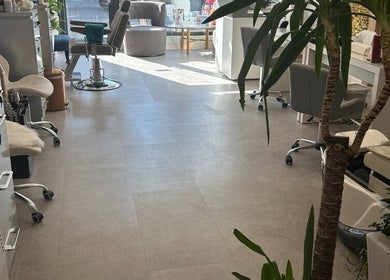 Modern Goddess Zone in Brighton And Hove, GB features elegant salon seating and lush plants.