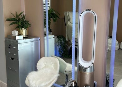 Chic salon interior at Modern Goddess Zone, Brighton And Hove, England, GB with stylish decor and mirrors.
