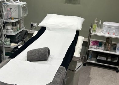 Modern Goddess Zone treatment room in Brighton And Hove, England, GB with a cozy therapy bed and spa essentials.