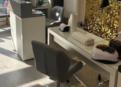 Modern nail station with gold accents at Modern Goddess Zone, Brighton And Hove, England, GB.