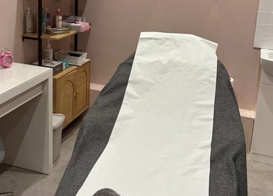 Cozy treatment room at Modern Goddess Zone, Brighton And Hove, England, GB, featuring a treatment bed and essentials.