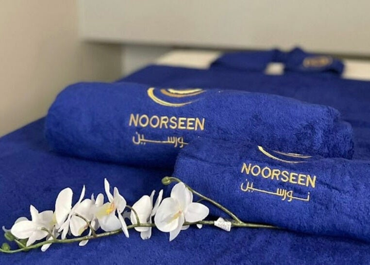 Luxury blue Noorseen Spa towels and flowers at نورسين سبا - الملك فيصل, Distract, Riyadh Province, SA.