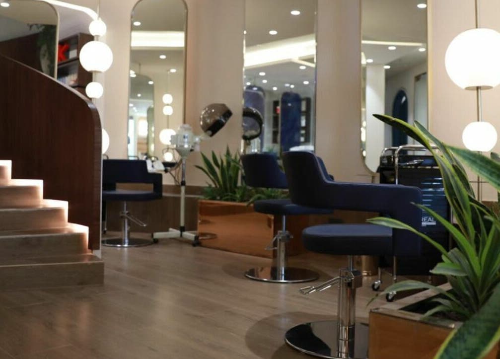 Elegant beauty stations at نورسين سبا - قرطبة, Riyadh, with modern chairs and ambient lighting.