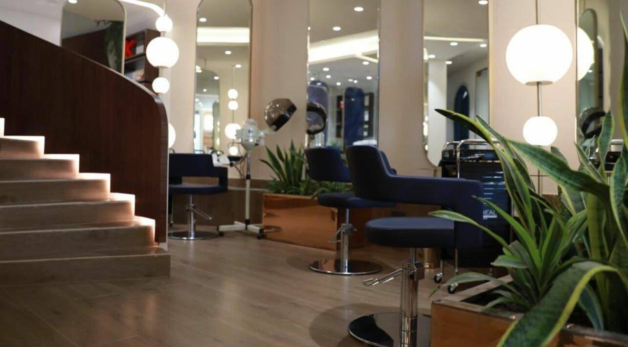 Elegant beauty stations at نورسين سبا - قرطبة, Riyadh, with modern chairs and ambient lighting.
